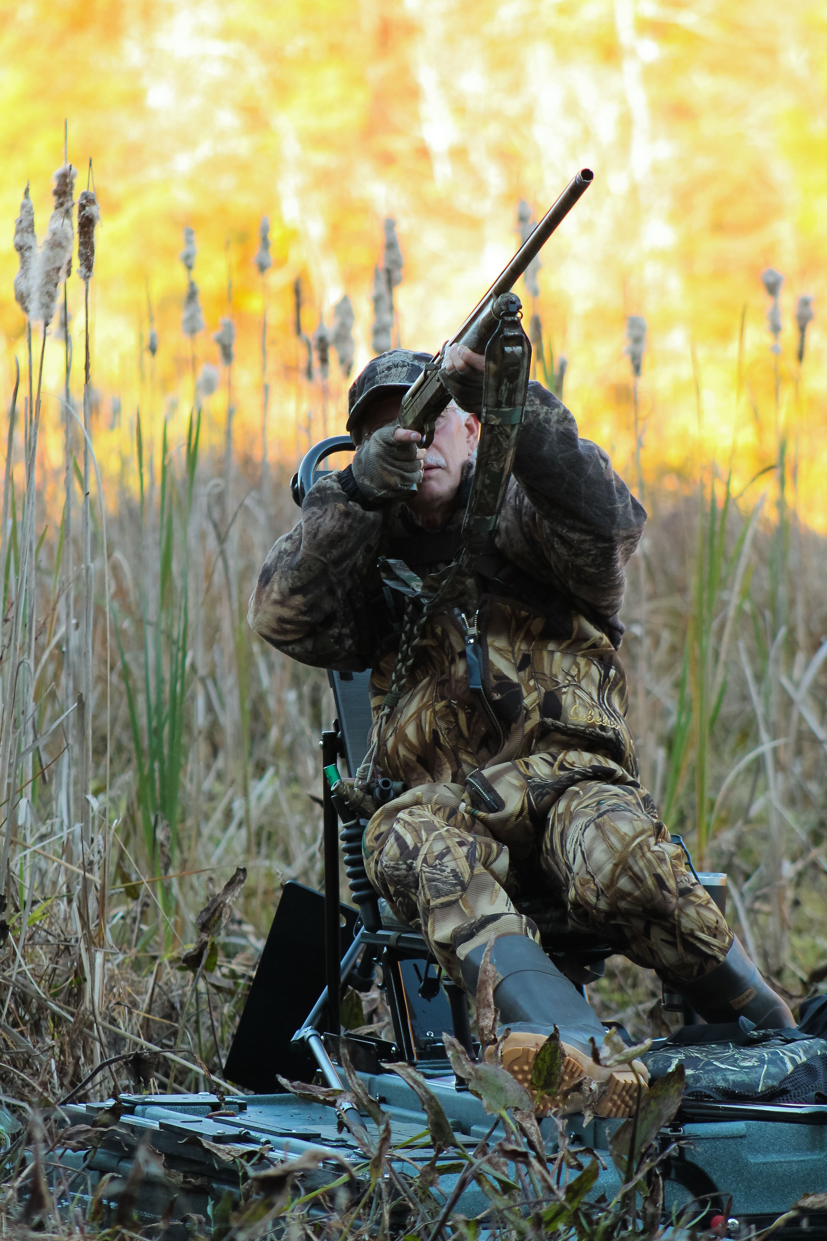 Hunter Taking Shot on Portable Kayak